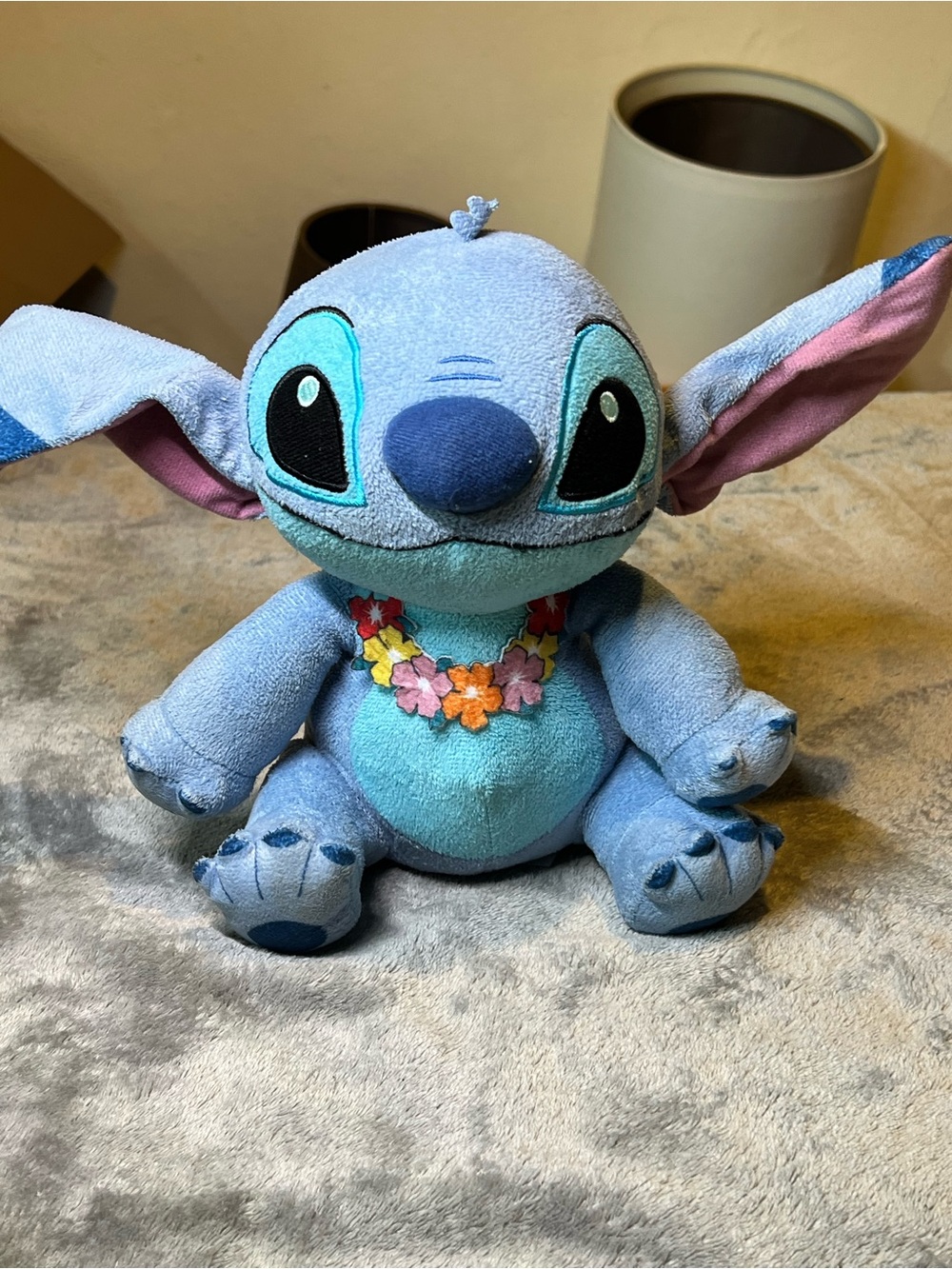Disney Light Blue Stitch-Inspired Plush with Pink Ear Accents and Floral Lei